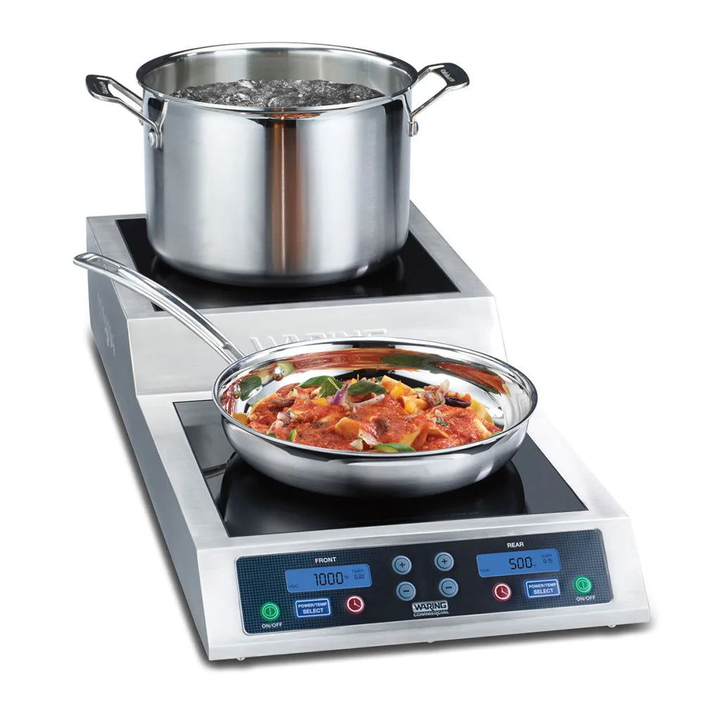 Induction cooktop with a pot and pan on a white background