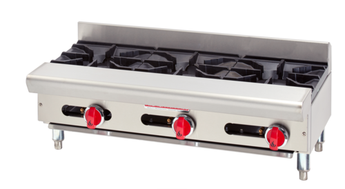 Stainless steel gas range with four burners on a white background