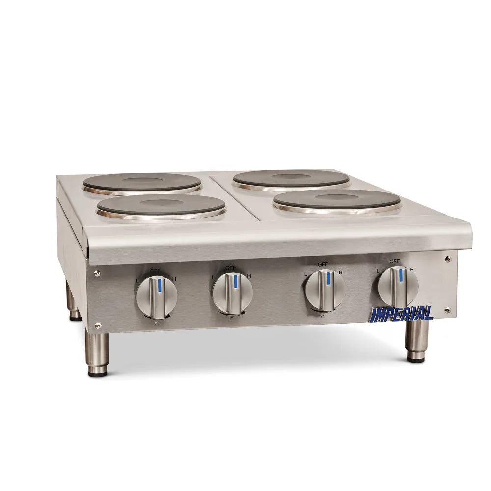 Stainless steel hot plate with four burners and control knobs on a white background, branded 'Imperial'.