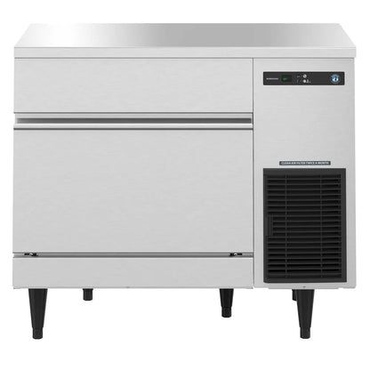 Commercial freezer with a white exterior and black interior on a white background
