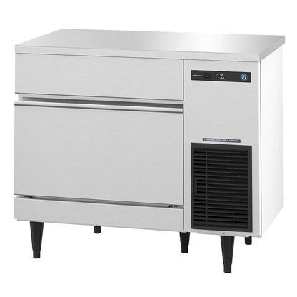 Commercial freezer with stainless steel door and black interior on a white background