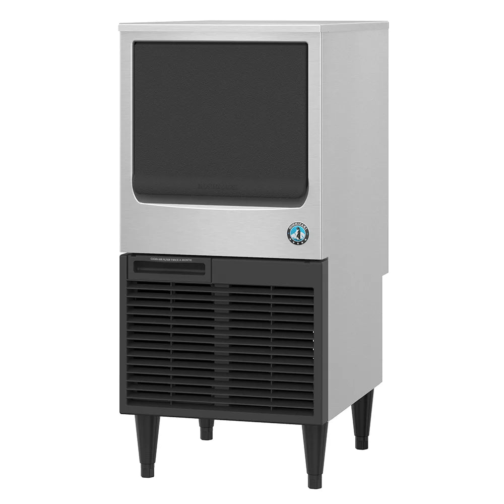 Commercial ice maker with black interior and base on a white background