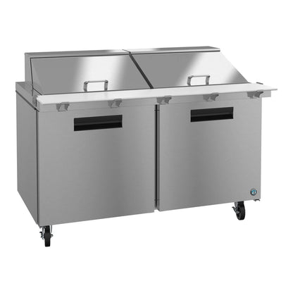 Stainless steel refrigerated counter with two doors on a white background